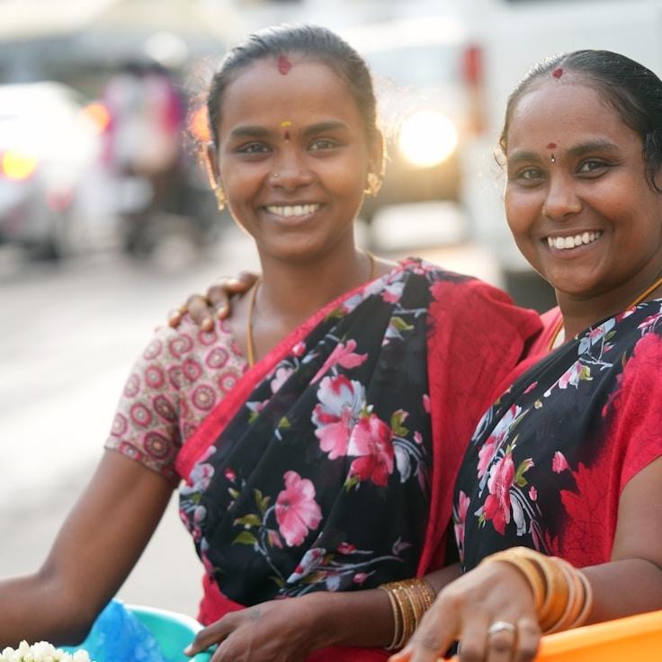 Avery Chen, Lead Design Curator at Kavarindo Melux, reviewing corporate floral arrangements